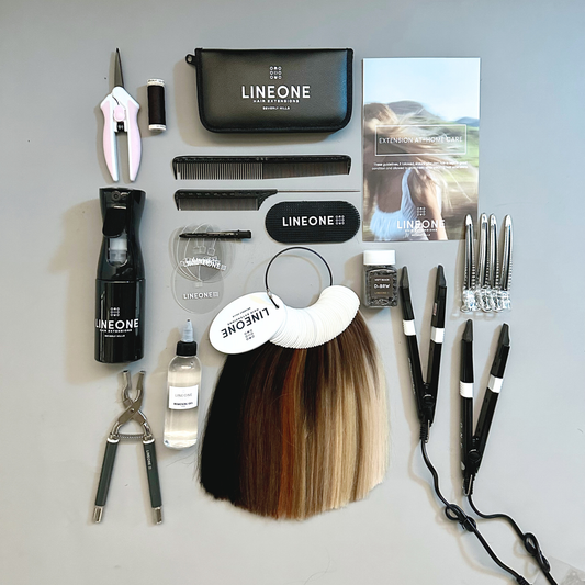 The Hybrid Class Kit flat lay with pliers flat iron tools weft samples and LINEONE Hair pouch