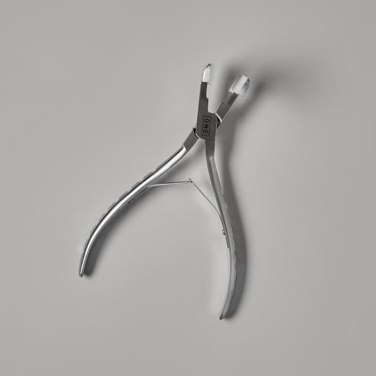 LINEONE Hair Tape-In Pressing Plier with stainless steel arms and ribbed grips engraved One