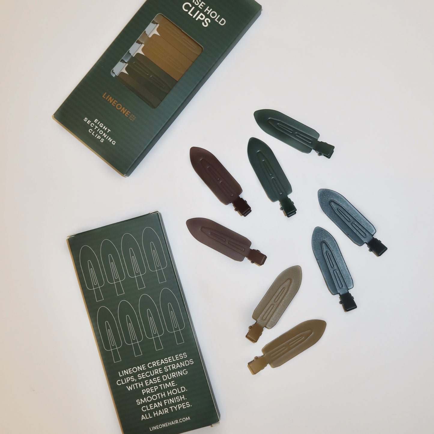 LINEONE Hair Please Hold Clips two boxes and scattered set of eight clips with creaseless tip illustration