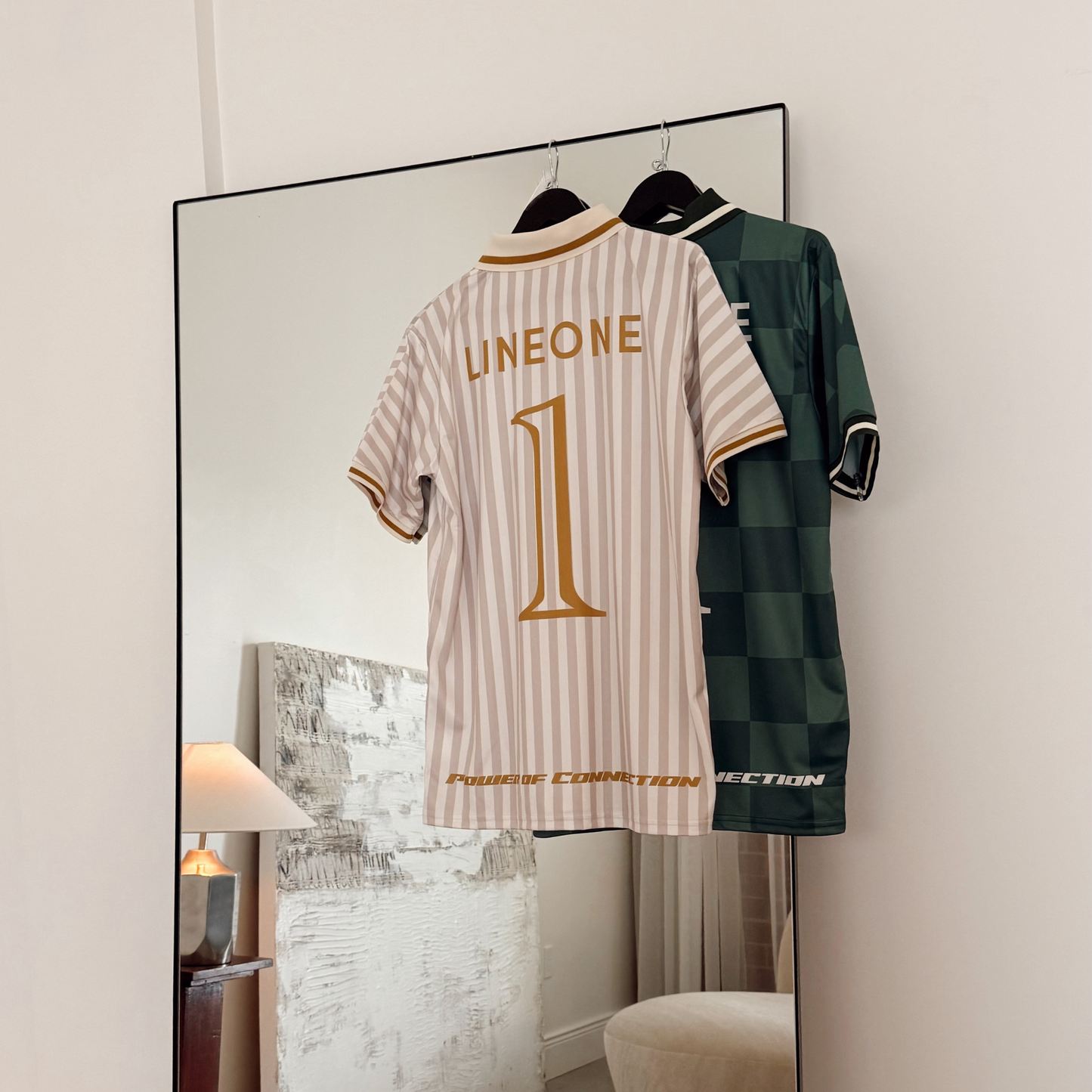 Curly brunette in LINEONE Hair Team Works Jersey in green checkered home kit with Hair Miles chest print