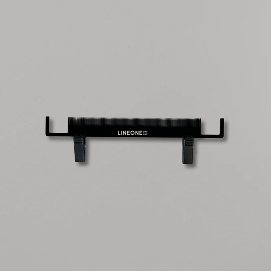LINEONE Hair Artist's Palette weft holding tool in black with rubber-grip clips and fine comb teeth