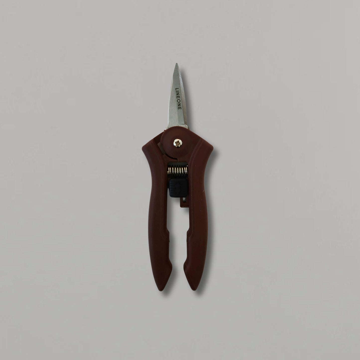 LINEONE Bond mini trimmer hero shot standing upright showing full tool with dark brown handle and stainless steel blade on gray background