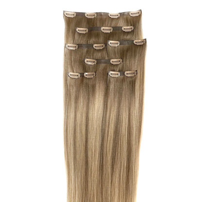 LINEONE Hair Bright Blonde clip-in extension wefts laid flat showing sandy blonde balayage from root to tip