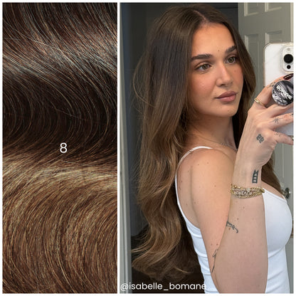 Mirror selfie of model with LINEONE Hair 8 Rooted Brunette (highlights) extensions, long wavy brunette hair with caramel ends