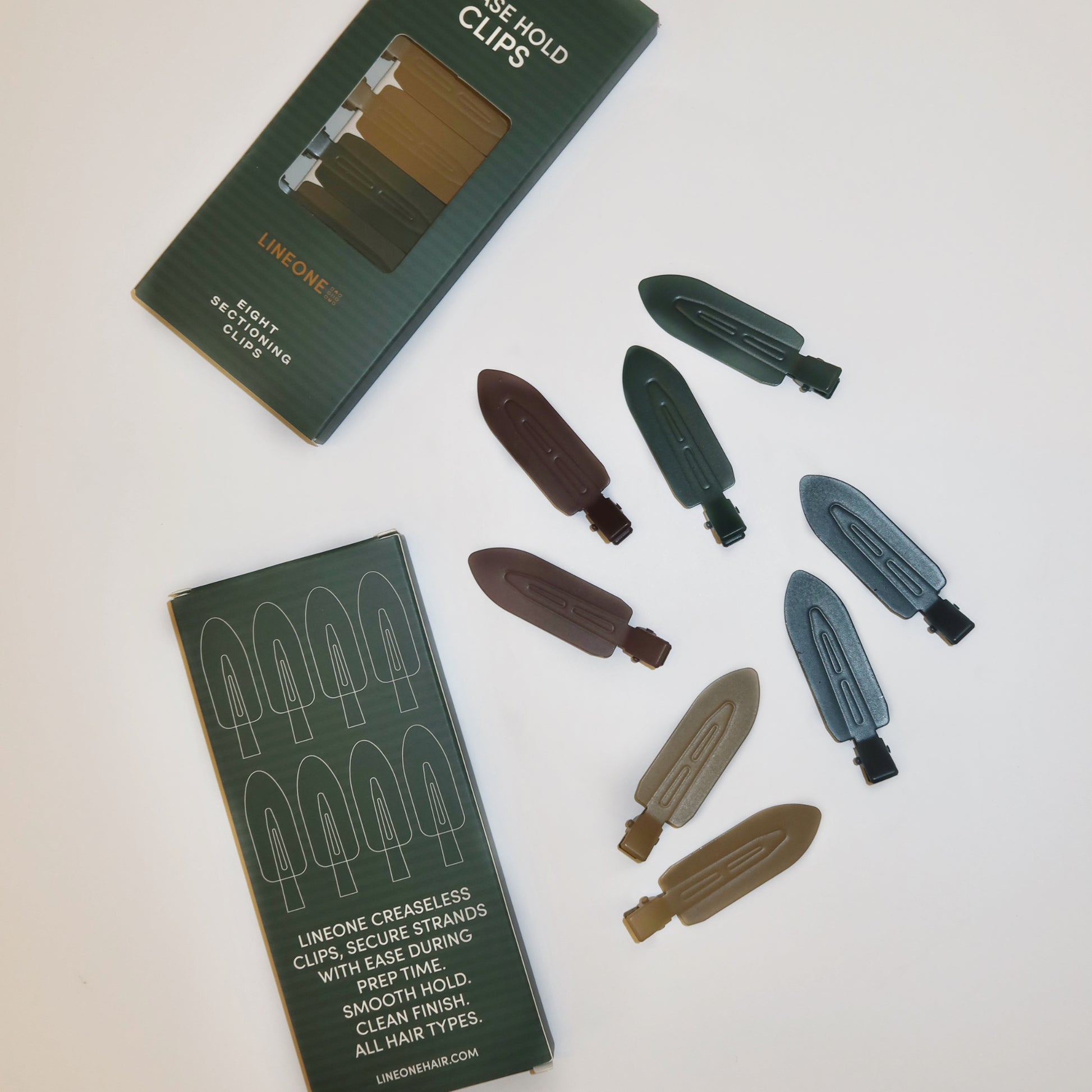 LINEONE Hair Please Hold Clips two boxes and scattered set of eight clips with creaseless tip illustration