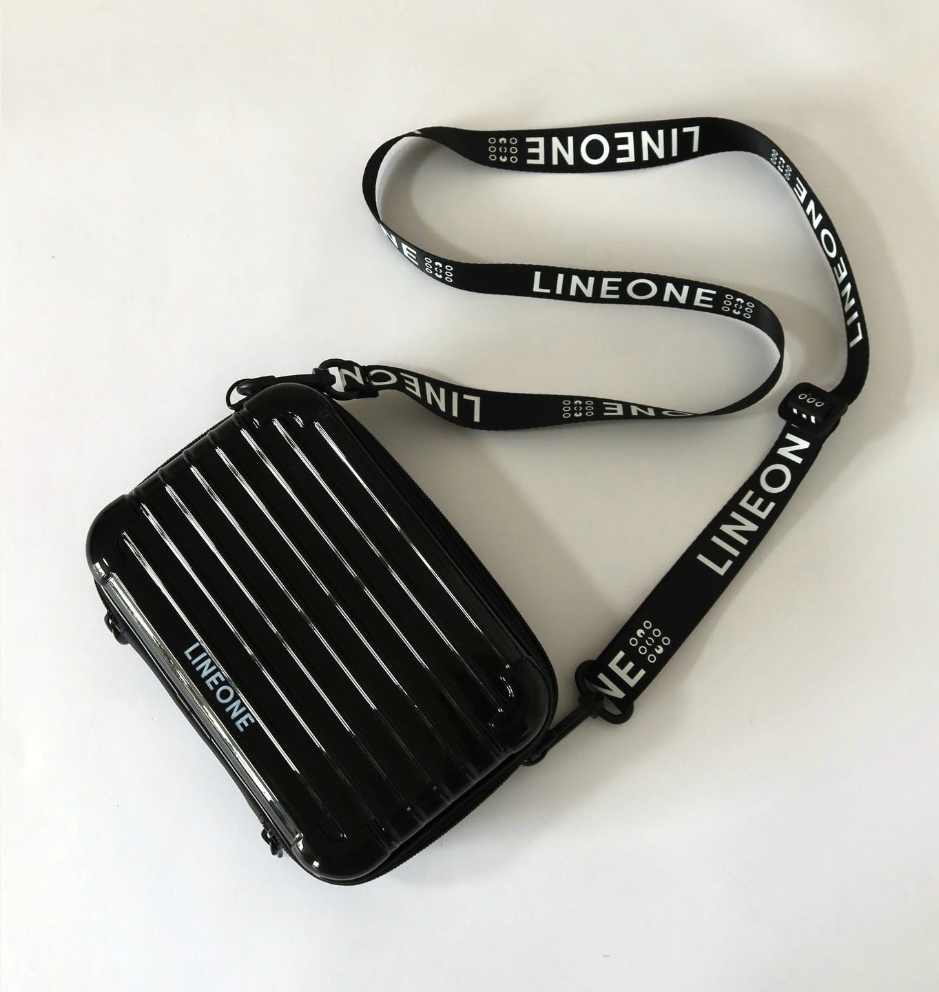 LINEONE Hair Weft Extension Toolkit closed black hard-shell case with LINEONE branded crossbody lanyard
