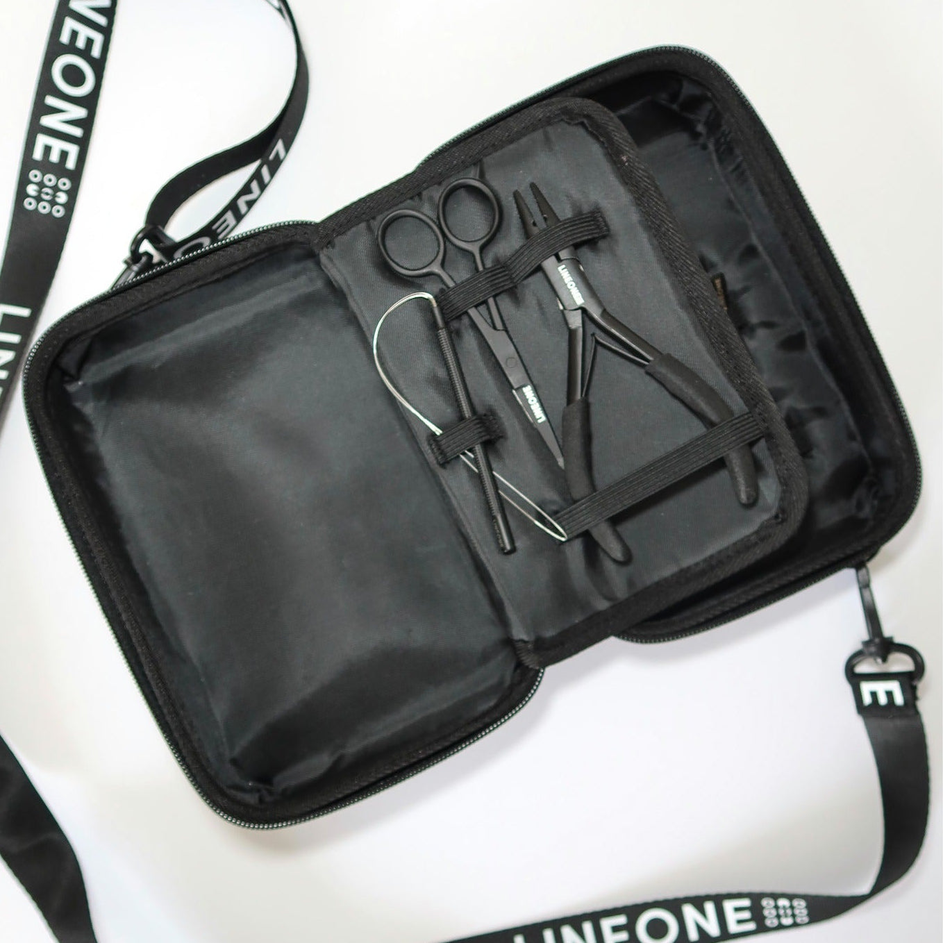 LINEONE Hair Weft Extension Toolkit open case revealing scissors, weft pliers and threader tools